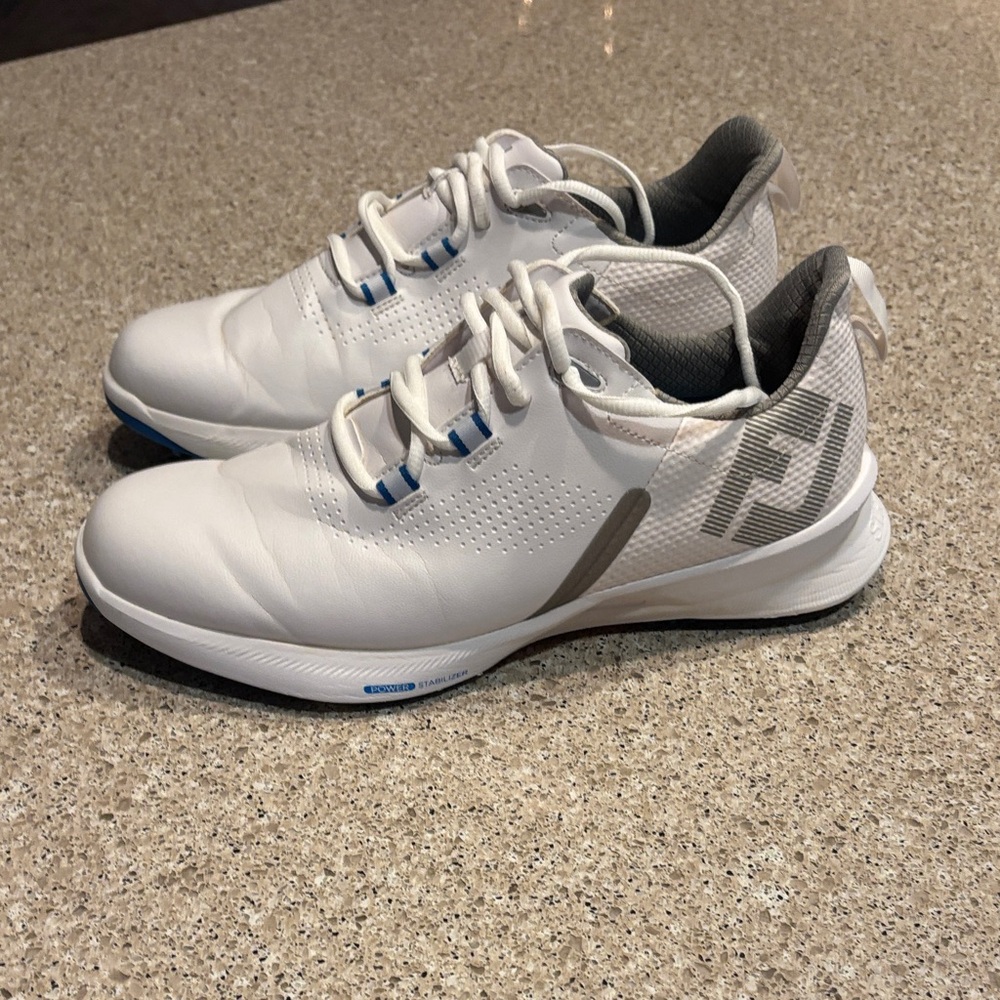 White Footjoy golf shoes with Blue Accents. Size 8 men’s shoes. Worn twice.